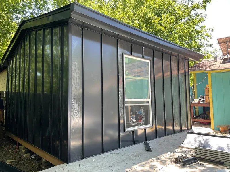 Black standing seam metal wall panels for Metal Roof Installation in Kimball