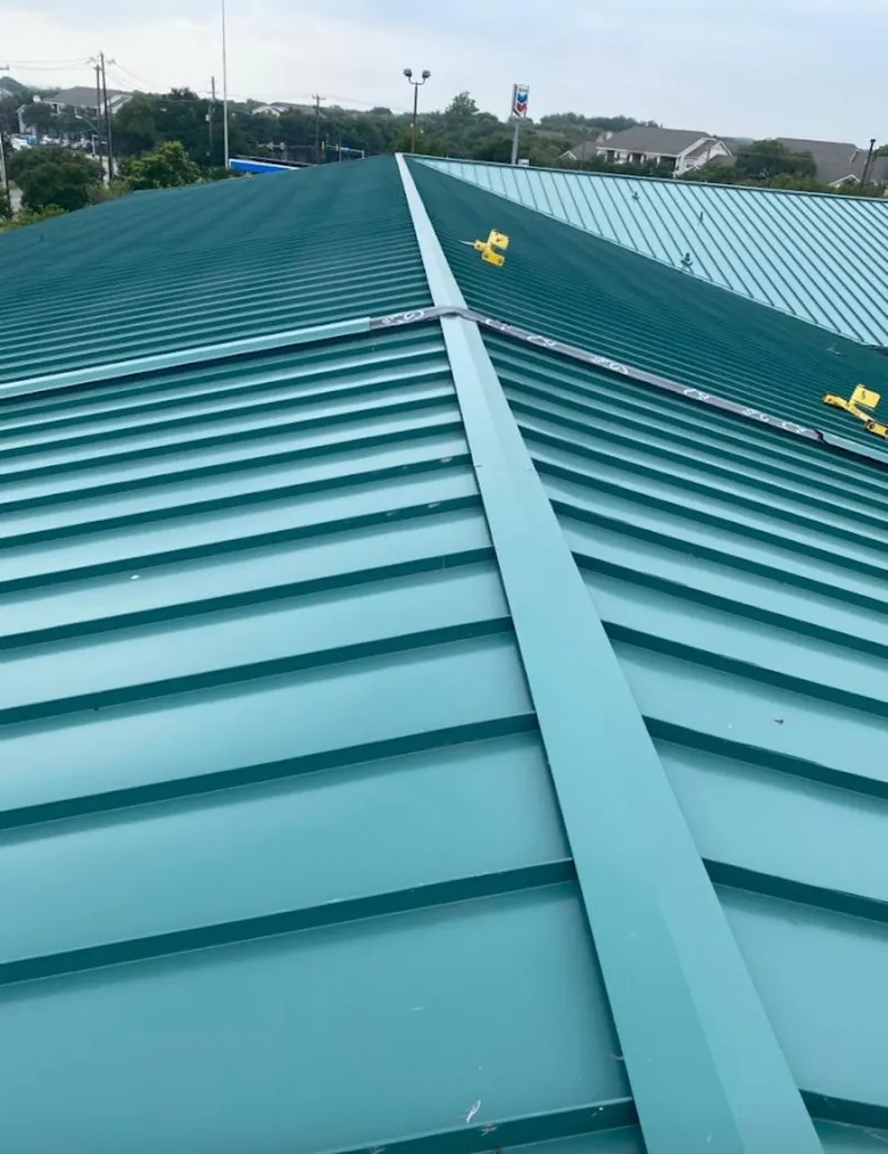 Green commercial metal roof ridge and valley for Metal Roof Repair in Kimball