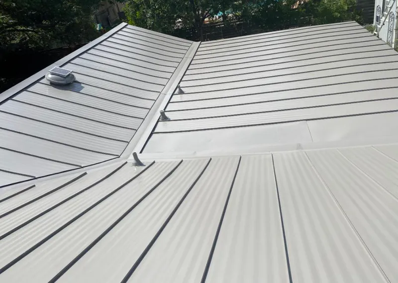 Solar attic fan installed on a metal roof for Roof Ventilation in Kimball